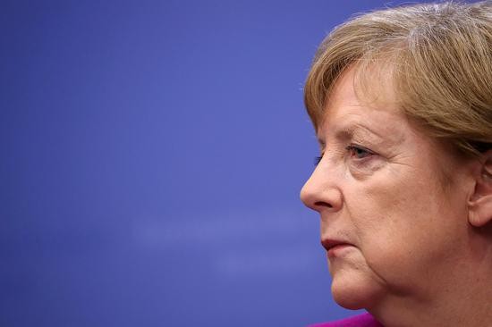 当地时间5月28日,默克尔参加欧盟特别峰会。视觉中国/图