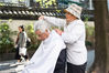 2017年10月26日，杭州，78岁的魏奶奶正在给人理发。