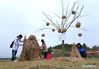 Students of Nanjing Forestry University make straw sculptures during a straw design contest at Xitian agriculture park in Nanjing, capital of east China's Jiangsu Province, Nov. 11, 2018. (Xinhua/Sun Can)