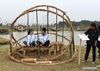 Students of Nanjing Forestry University sit on the straw sculptures during a straw design contest at Xitian agriculture park in Nanjing, capital of east China's Jiangsu Province, Nov. 11, 2018. (Xinhua/Sun Can)