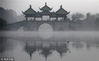 On November 13, 2018, Yangzhou Slender West Lake was hazed by a thin veil of fog, which presented a picturesque scenery. 