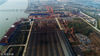 2018年11月22日，江苏扬州，航拍江都区夹江大桥沿岸港口造船企业一片忙碌繁荣景象。