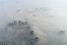2018年11月26日，江苏常州的高层建筑在大雾下若隐若现。