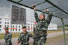 2018年12月8日，云南普洱，武警云南总队普洱支队组织机关军事体能考核。通过400米障碍。