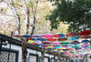 2018年12月2日，南京。在南京1912街区的一条步行街，百余把彩色伞空中倒挂，与古色古香的民国建筑群相映成趣，形成独特“五彩伞阵”，也给南京1912街区增添了一份清新亮丽。