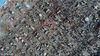2018年2月13日，山东滨州，从空中俯瞰当地一个数万人规模的年货大集，市场上人山人海，摊位如棋盘上的棋子一样密集排列，场面壮观不输春运。