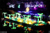 2018年2月7日晚，四川广安，2018年四川省广安市纪念改革开放40周年新春灯展上的“花篮花灯”。