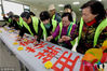 Nanjing, Mar 19. Volunteers signed their names on the banner solemnly which promoted smoke free tribute. 
