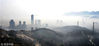 2018年3月25日，江苏连云港市海滨城区建筑和山峦在雾中若隐若现。