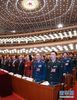3月5日，第十三届全国人民代表大会第一次会议在北京人民大会堂开幕。这是全国人大代表高唱国歌。 新华社记者 李刚 摄