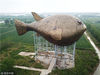 2018年4月21日，江苏镇江，航拍90米长巨型河豚塔，悬浮空中犹如“飞鱼”。