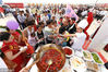 Visitors taste crawfish for free at the at the Shrimp-Rice Symbiosis Demonstration Park in Mingzuling Town, Xuyi County, May 18, 2018.