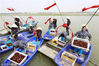 Farmers fish for crawfish at the Shrimp-Rice Symbiosis Demonstration Park in Mingzuling Town, Xuyi County, May 18, 2018.
