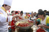 Visitors watch cooking crawfish at the Shrimp-Rice Symbiosis Demonstration Park in Mingzuling Town, Xuyi County, May 18, 2018.
