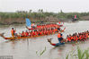 Contestants take part in a fish trap and a dragon boat race, Huai’an City, Jiangsu Province, June 16, 2018.
