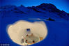 2014年12月4日消息（具体拍摄时间不详），坐落在瑞士高山上的“冰雪酒店”（Iglu-Dorf）完全就地取材由冰雪建成，被称为世界上最“冷”的酒店，可以让客人深入体会爱斯基摩人的居住感受。这座酒店每年冬季在阿尔卑斯山到比利牛斯山脉的6个地点重建，从圣诞节开放至次年4月，每个村落一晚能留宿38名客人，不过他们必须睡在置于厚厚的羊毛地毯上的睡袋里，以抵御零下40度的严寒。不过，住在这里虽然寒冷却也别有乐趣。客人可以享受丰盛的早餐、加香料的热葡萄酒，甚至还可以在冰天雪地里泡热水澡。所以这里的住宿费用并不便宜，周一到周四每晚99欧元，周五至周日则涨到每晚115欧元。Iglu-Dorf/Exclusivepix Media/视觉中国