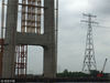 51年前，江苏第一条高等级跨江电缆从镇江五峰山引出，将光明输送至江淮大地。51年后，长江南京以下12.5米深水航道建成，滚滚江水迎来“巨轮时代”，但横江电缆却成了“巨轮”畅行的障碍。为了黄金水道的明天，长江沿岸现存“年龄”最大的跨江电塔今天被爆破拆除，同我们挥手再见。
 
