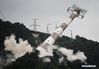 The south pylon of the Wufengshan power-line crossing on the Yangtze River is detonated in Zhenjiang, east China's Jiangsu Province, July 11, 2018. The two concrete pylons of the Wufengshan power-line were detonated on Wednesday to facilitate inland navigation of large vessels on the Yangtze River. (Xinhua/Li Xiang)