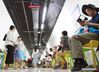 People enjoy the cool in an air-raid shelter in Nanjing, capital of east China's Jiangsu Province, July 15, 2018. The local government opened seven air-raid shelters for people to avoid summer heat, and provided free tea, free wifi, newspapers and medical service in some shelters. 