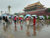2018年7月17日，农历头伏首日，北京遭遇大到暴雨天气， 故宫及天安门景区的游客冒雨游览，热情不减。