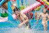 Children have fun at a water amusement park in Xuyi County in Huai'an City, east China's Jiangsu Province, July 16, 2018. (Source: Xinhua/Zhou Haijun Editor:ourjiangsu.com/Liu Yuan)