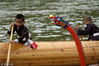 2018年7月8日，贵州黔东南，苗族小朋友在独木龙舟上学习划浆。