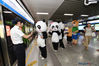 Staff members of Nanjing Hongshan Forest Zoo, dressed as three giant pandas, a Tibetan antelope and an elephant, drew a lot of attention at the Zhujiang Road Station on Line 1 of the Nanjing Metro on Aug. 8. (Photo/VCG)