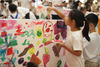 2018年8月10日，一场主题为“天使守护计划”的儿童公益涂鸦活动在南京德基广场举办，数十名小朋友在“涂鸦区”尽情发挥自己的想象力和创造力，共同完成一幅大型涂鸦作品。据介绍，主办方还邀请了六位患有听力障碍的孩子参加，借此用艺术的方式守护爱与希望，传播美好。