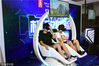 2018年8月3日，上海，ChinaJoy数码互动娱乐游戏展（CJ）在新国际博览中心举行，体验VR过山车的玩家。竹林枭/视觉中国