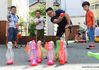 Guo Xinwang plays games with children at the Xiaoxihu kindergarten in Nanjing, capital of east China's Jiangsu Province, Sept. 6, 2018. Guo, born in 1993 and graduated from the Jiangsu Normal University, became the first and only male teacher of the Xiaoxihu kindergarten three years ago. There are 400 plus male teachers in Nanjing nowadays, up to three percent of the whole teachers working in kindergartens. (Xinhua/Li Bo) 