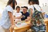 Guo Xinwang has fun with children at the Xiaoxihu kindergarten in Nanjing, capital of east China's Jiangsu Province, Sept. 6, 2018. Guo, born in 1993 and graduated from the Jiangsu Normal University, became the first and only male teacher of the Xiaoxihu kindergarten three years ago. There are 400 plus male teachers in Nanjing nowadays, up to three percent of the whole teachers working in kindergartens. (Xinhua/Li Bo) 