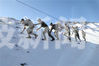 巡逻官兵踏雪巡逻在祖国边防线上。
