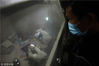 2019年1月10日，在贵州省丹寨县一家民族银饰加工坊内，技术工人在打磨抛光银酒杯。