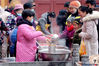 A volunteer distributes free porridge to people in Suzhou's Dinghui Temple. [Photo/VCG]
The Laba Festival is a traditional Chinese festival on the eighth day of the 12th month of the lunar calendar and the festival falls on Jan. 13 this year.
In traditions of many parts of China, people eat a special Laba porridge, usually made with at least eight ingredients, representing people's prayers for harvest.