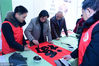 2019年1月16日下午，江苏省南通市，16位慈善书画家在北城街道林桥村为村民现场写春联。