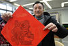 2019年1月5日，江苏扬州，扬州雕版印刷非遗传承人李华俊展示自己创作的雕版印刷猪年生肖“福”字。