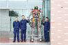 2019年11月13日，重庆市沙坪坝区消防救援支队大学城中队，刘杰和他的同事和消防机器人作品合影。