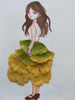 An illustrated girl wears a skirt made of leaves.