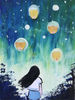 A girl watches sky lanterns.