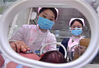 2019年11月17日，在石家庄新乐市医院新生儿科，医护人员在为早产儿检查身体。