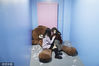 Two woman rest in a room with a big toy in the museum in Suzhou, Jiangsu province, on Nov 18, 2019. [Photo/VCG] 