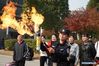 A police officer lectures about the danger of flammables and explosives during a fire awareness event in Nanjing, east China's Jiangsu Province, Nov. 8, 2019. (Xinhua/Ji Chunpeng)