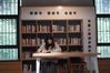 A woman reads at a public library in Yinxiang community of Moling subdistrict in Nanjing, east China's Jiangsu Province, Nov. 6, 2019. Moling subdistrict in Nanjing has established five mini libraries for local residents. (Xinhua/Ji Chunpeng)