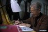 Photo taken on Nov. 7, 2019 shows the survivor of the Nanjing Massacre Jing Zhizhen practicing calligraphy at home. This year marks the 82nd anniversary of the Nanjing Massacre, in which more than 300,000 Chinese were killed by the Japanese invaders who occupied Nanjing on Dec. 13, 1937, marking the start of six weeks of destruction, pillage, rape and slaughter in the city. By Dec. 12, 2019, the number of registered survivors of the massacre has decreased to 78. Reporters from Xinhua spent many years to look for the survivors of Nanjing Massacre and record their current lives. (Xinhua/Han Yuqing)

