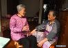 Photo taken on Nov. 7, 2019 shows the survivor of the Nanjing Massacre Guan Shunhua chatting with her daughter Liu Yufang at home. This year marks the 82nd anniversary of the Nanjing Massacre, in which more than 300,000 Chinese were killed by the Japanese invaders who occupied Nanjing on Dec. 13, 1937, marking the start of six weeks of destruction, pillage, rape and slaughter in the city. By Dec. 12, 2019, the number of registered survivors of the massacre has decreased to 78. Reporters from Xinhua spent many years to look for the survivors of Nanjing Massacre and record their current lives. (Xinhua/Ji Chunpeng)