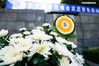 Photo taken on Dec. 3, 2019 shows flowers laid before the memorial hall wall where the victims' names are engraved during a commemoration activity in Nanjing, capital of east China's Jiangsu Province. Starting Tuesday, family members of the victims of the massacre began a series of commemoration activities such as laying flowers and burning incense before the memorial wall where the victims' names are engraved. The Nanjing Massacre took place when Japanese troops captured the city, then China's capital, on Dec. 13, 1937. Over six weeks, they killed 300,000 Chinese civilians and unarmed soldiers. In February 2014, China's top legislature designated December 13 as the national memorial day for victims of the Nanjing Massacre. Family members of the victims also started to hold commemoration activities at the memorial hall in December of the same year. (Xinhua/Li Bo)