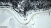 2019年2月19日，新疆巩乃斯河和静县巩乃斯镇段的河道冰雪开始融化景象（无人机拍摄）。