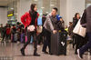 2019年2月6日，天津滨海国际机场，孩子们坐在行李箱上姿态各异，成为春运机场里的一道亮点。