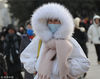 2019年2月7日，北京，大年初三，受冷空气影响气温骤降，寒风中游客包裹严实在天安门广场游览拍照，热情不减。