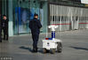 2019年3月16日，北京，两个机器人警察在西单街头执勤，科技感十足。